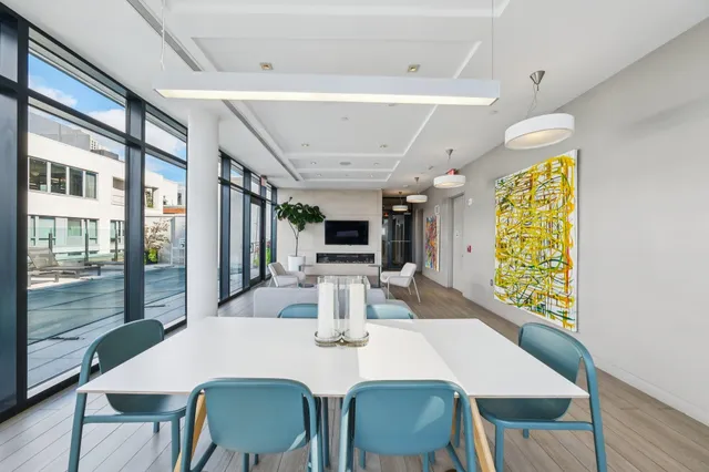 a view of swimming pool with outdoor seating