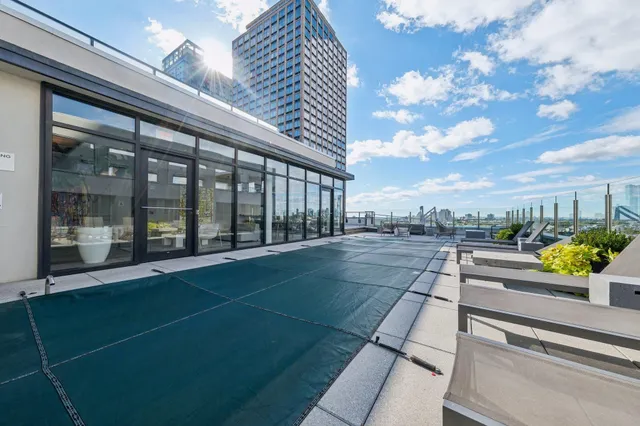 a view of a patio with couches table and chairs and potted plants