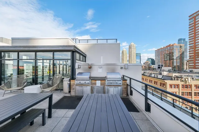 a balcony with chairs and table