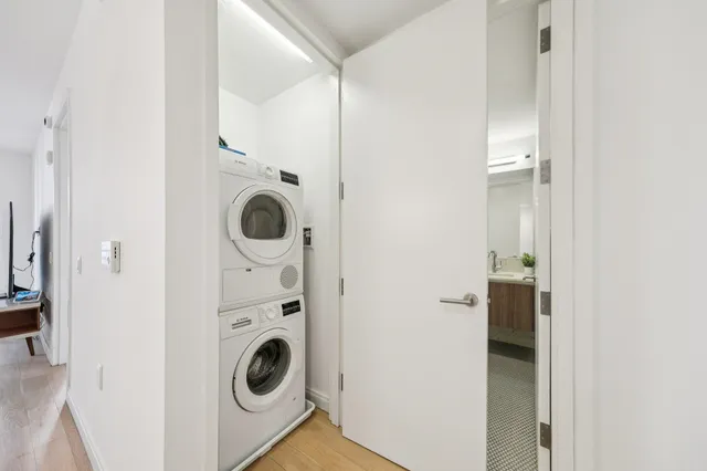 a view of a hallway with washer and dryer