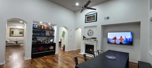 a kitchen with a table and chairs in it