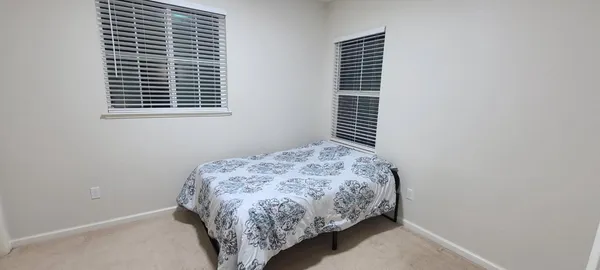 a bathroom with a double vanity sink mirror and shower