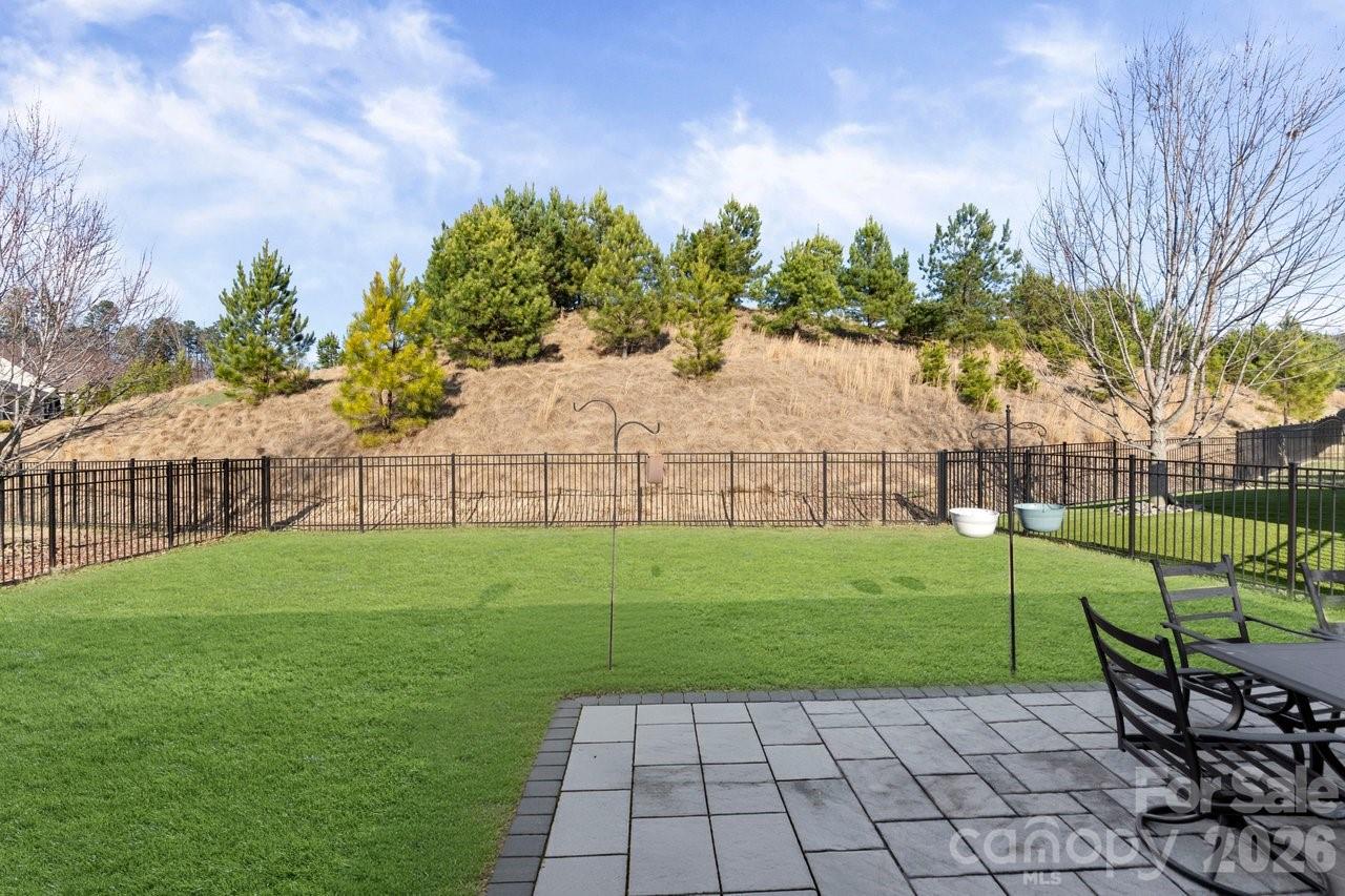 4979 Looking Glass Trail Denver, NC 28037 - Photo 15 of 46 a view of a backyard with a garden