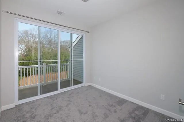 a view of a room with sliding glass door