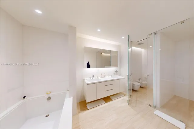 a bathroom with a bathtub sink and toilet