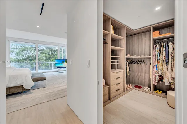 a hallway with furniture and window