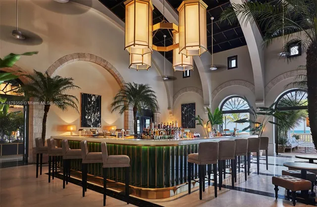 a view of a chairs and table in patio