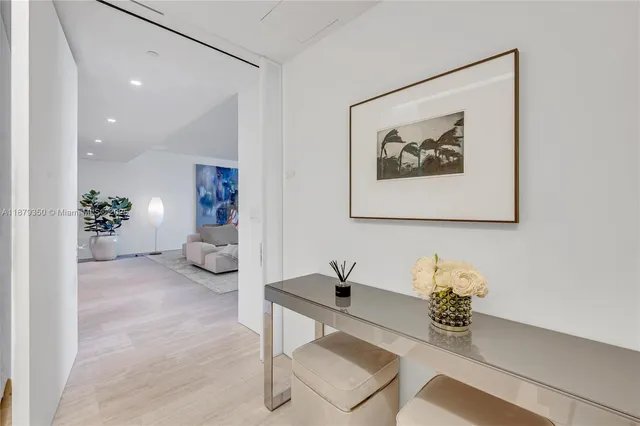 a living room with furniture and flowers