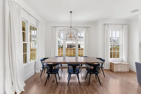 a dining room with furniture window wooden floor