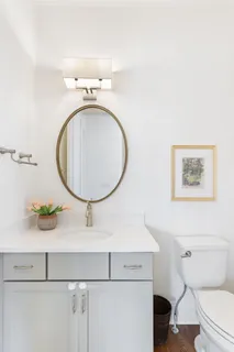 a view of a hallway with wooden floor and windows