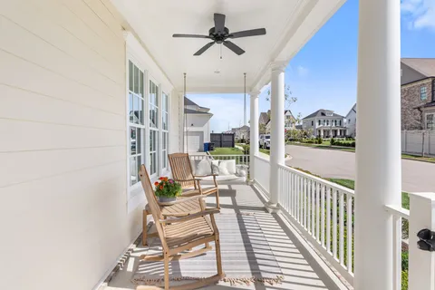 a view of a balcony with chairs