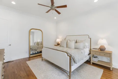 a bathroom with a bathtub a double vanity sink and mirror