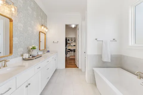 a bathroom with a bathtub and a shower
