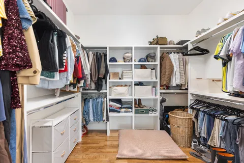 a living room with fireplace furniture and a floor to ceiling window