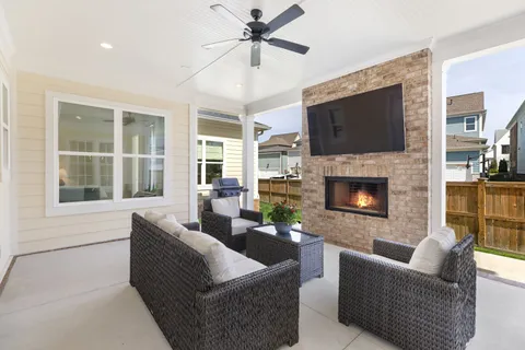 a view of a house with a yard from a patio