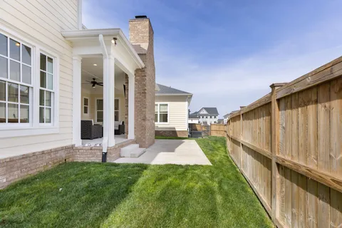 a bedroom with a bed a desk and chair