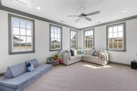 a view of a room with toys and windows