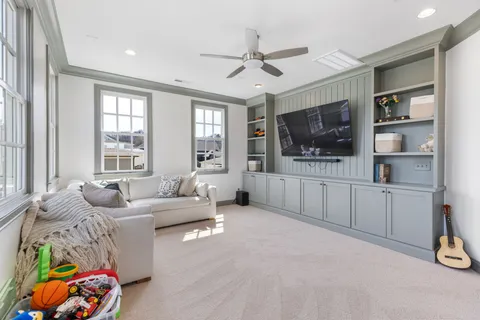 a bed room with a bed and a television