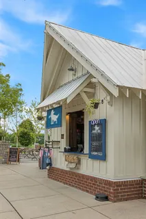 an aerial view of residential houses with outdoor space and street view