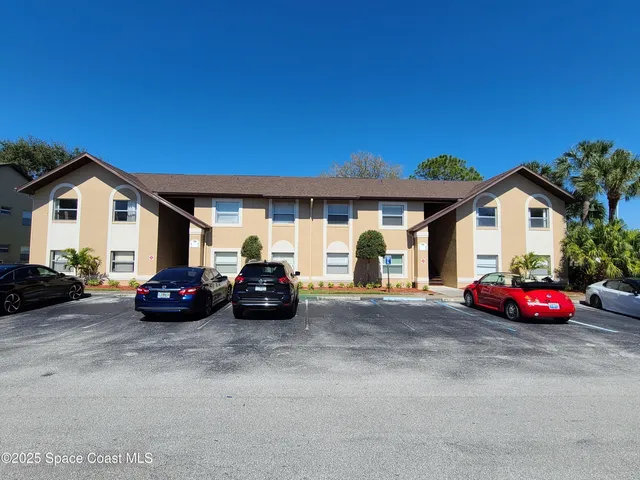 a view of car parked in front of a house