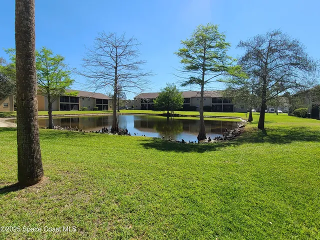 a sign that is sitting in front of a house