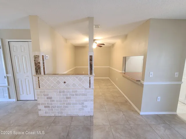 a kitchen with a stove and a refrigerator