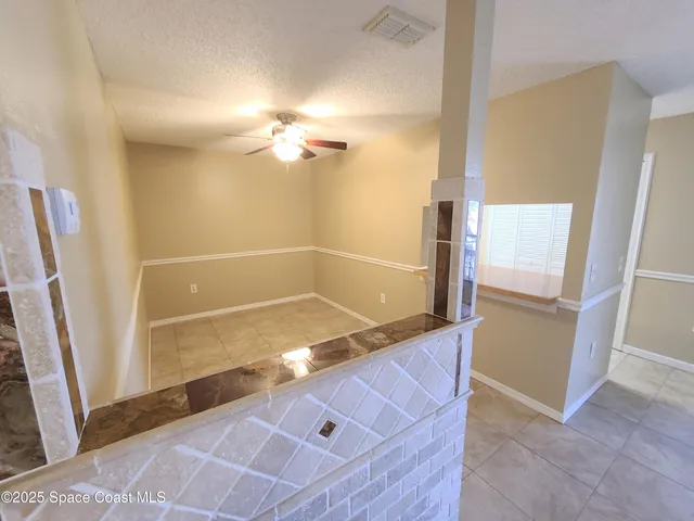 a utility room with cabinets washer and dryer