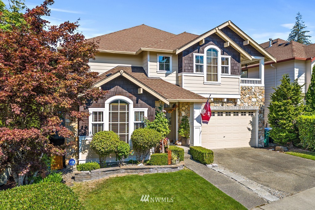 16718 Southeast 165th Way Renton, WA 98058 - Photo 40 of 40 a front view of a house with a yard and garage