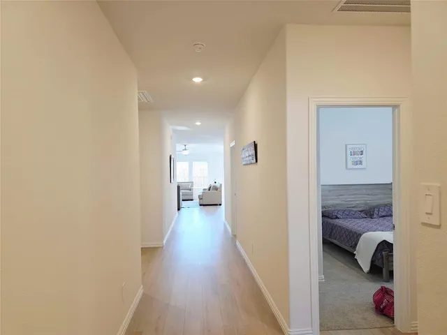 a view of a bedroom from a hallway