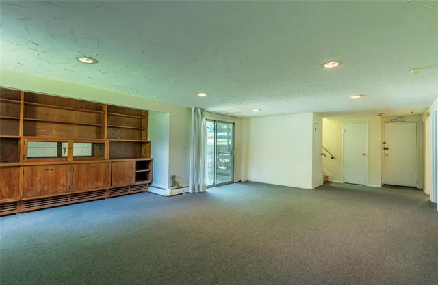 an empty room with a empty space and window