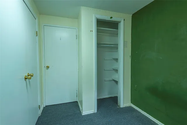 a bathroom with a shower and a door