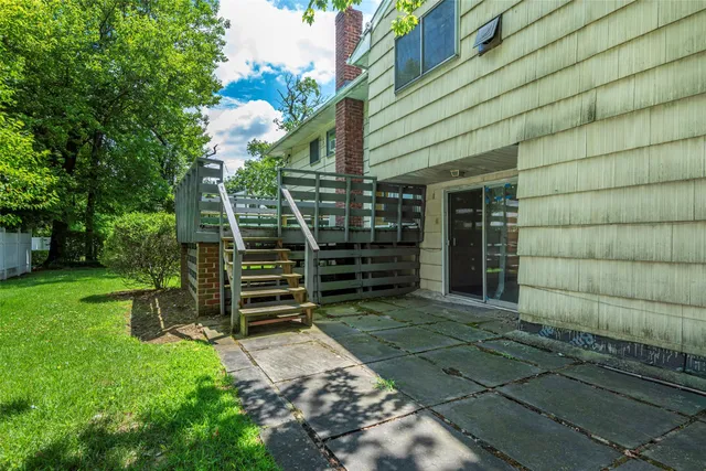 a view of a wooden door and an outdoor space