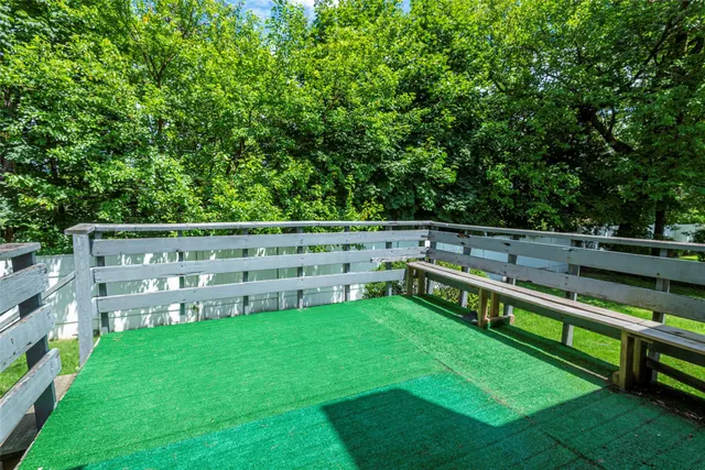 a view of a chair and table in the yard