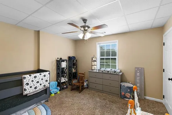 a bedroom with furniture and a window