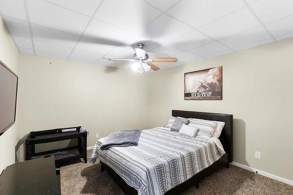 138 Herbert Neal Road Milan, TN 38358 - Photo 13 of 19 a bedroom with a bed and a chandelier