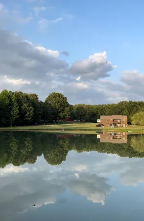 a view of a lake with houses in the back