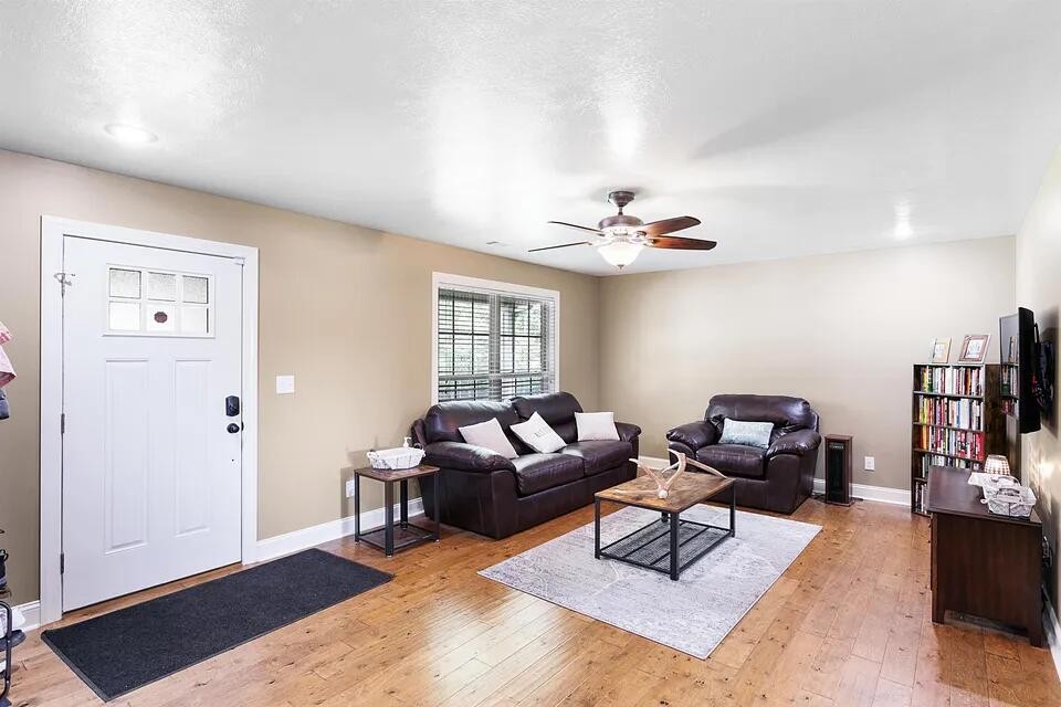 138 Herbert Neal Road Milan, TN 38358 - Photo 5 of 19 a living room with furniture and wooden floor