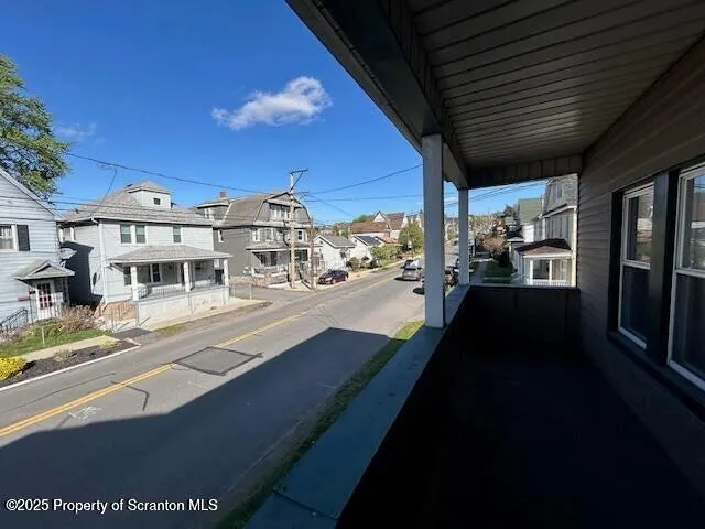 a view of a balcony with chairs