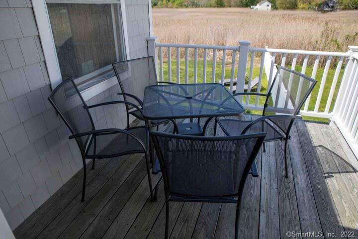10 Grove Way, Unit 10 Clinton, CT 06413 - Photo 20 of 21 a view of balcony with wooden floor and outdoor seating