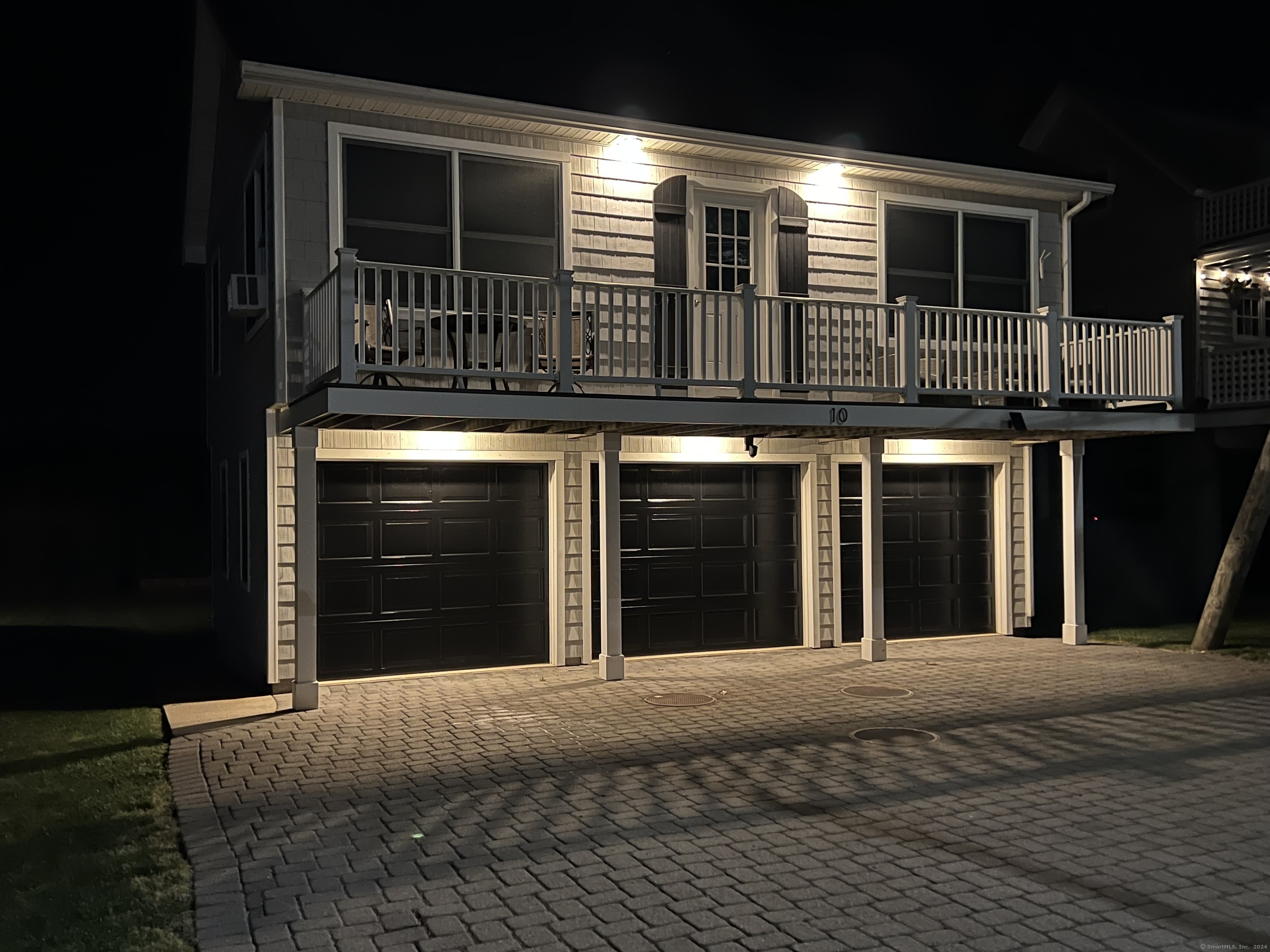10 Grove Way, Unit 10 Clinton, CT 06413 - Photo 2 of 21 a view of a house with entryway and a balcony