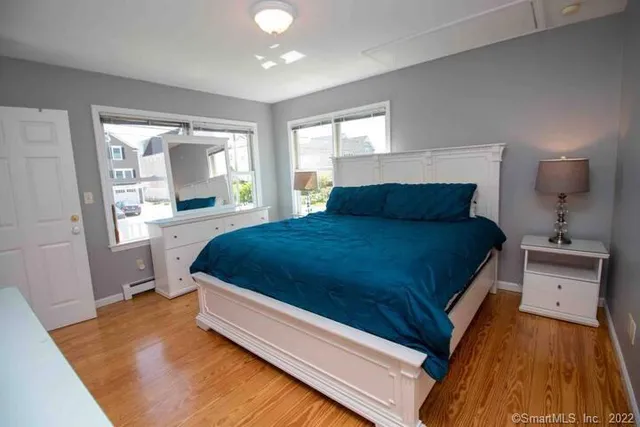 a spacious bedroom with a bed and window