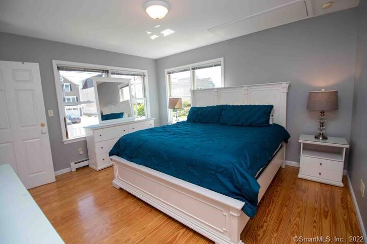 10 Grove Way, Unit 10 Clinton, CT 06413 - Photo 8 of 21 a spacious bedroom with a bed and window