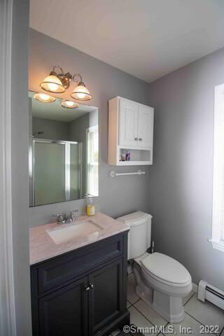 10 Grove Way, Unit 10 Clinton, CT 06413 - Photo 10 of 21 a bathroom with a toilet sink and mirror