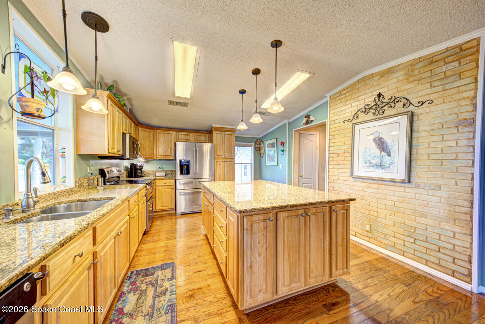 176 Woodsmill Boulevard, Unit 177 Cocoa, FL 32926 - Photo 14 of 63 12 kitchen with pendant lights