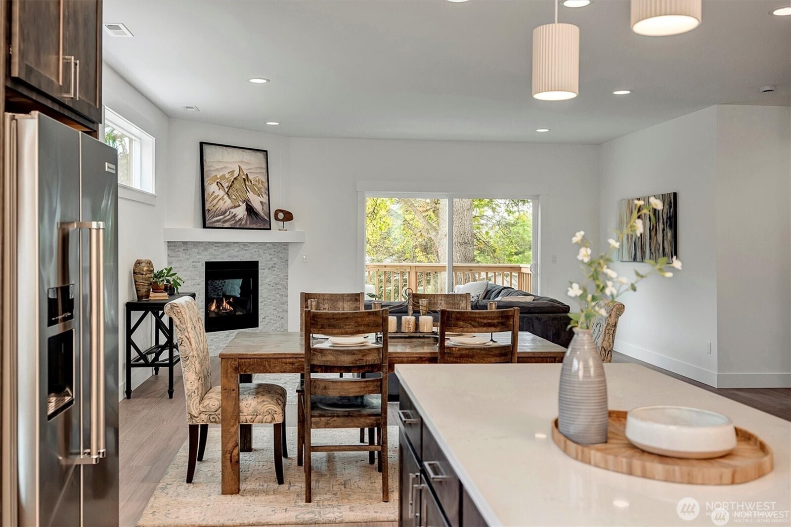 10645 Southeast 170th Pl-lot 11 Renton, WA 98055 - Photo 13 of 29 a dining room with furniture a large window and plants