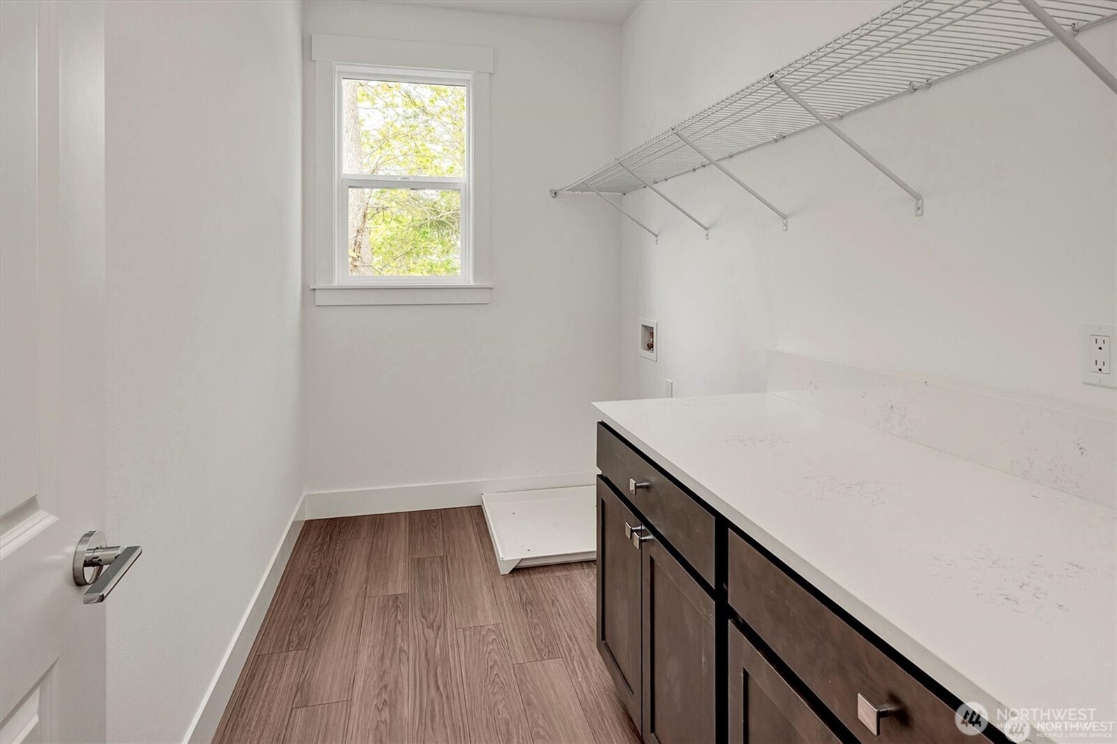 10645 Southeast 170th Pl-lot 11 Renton, WA 98055 - Photo 24 of 29 a view of utility room with wooden floor and fan