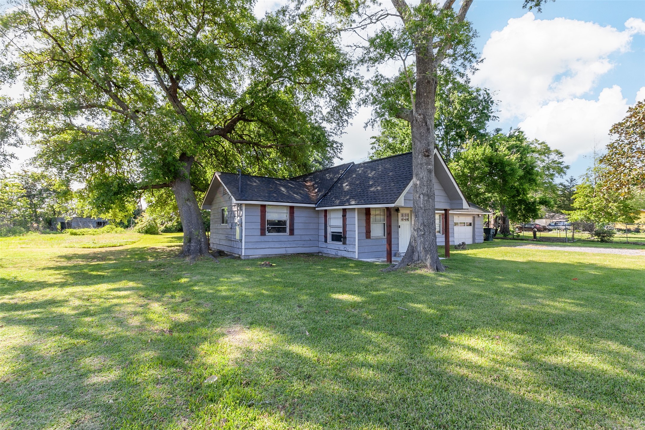5265 Gober Road Beaumont, TX 77708 - Photo 3 of 21 a front view of a house with garden