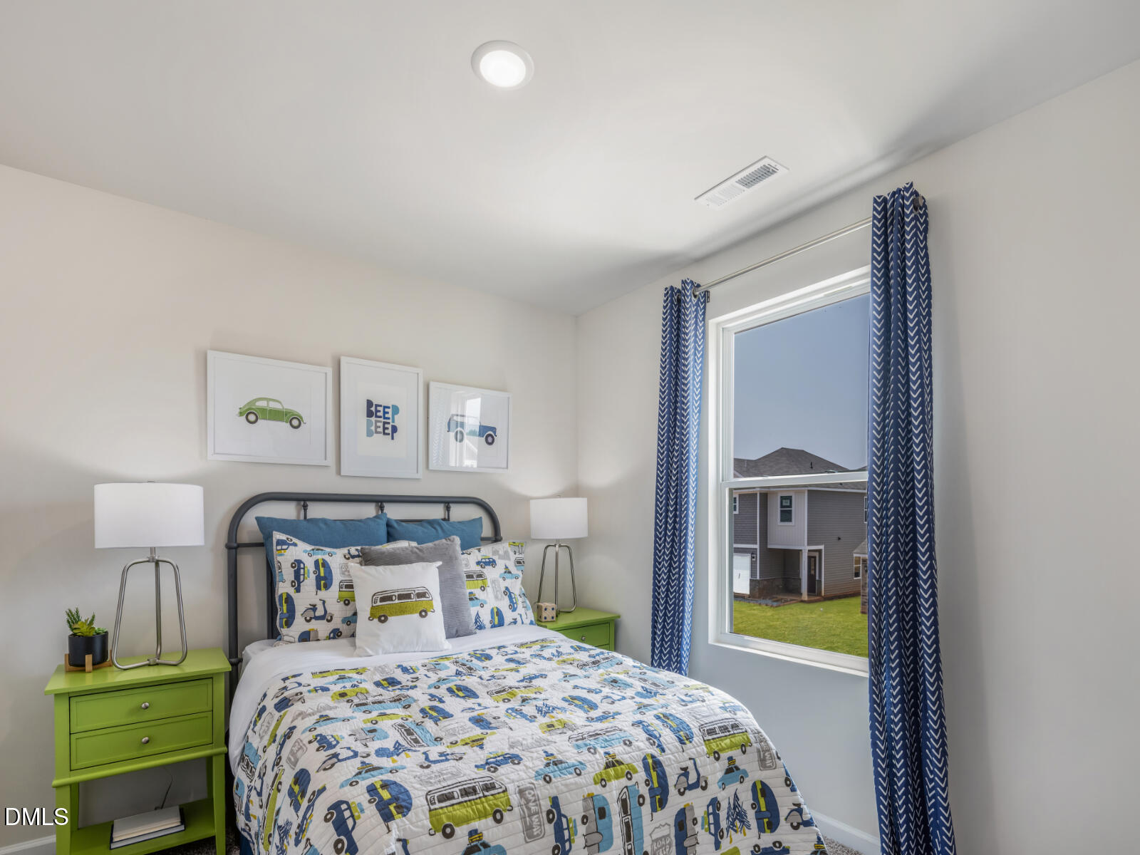 1511 Hatteras Road Durham, NC 27703 - Photo 9 of 12 a bedroom with a bed and a painting on the wall