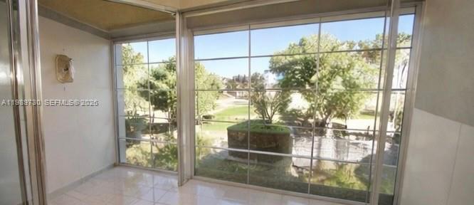 3531 Inverrary Drive, Unit 310 Lauderhill, FL 33319 - Photo 2 of 10 a room with window and a glass door