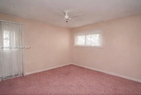 3531 Inverrary Drive, Unit 310 Lauderhill, FL 33319 - Photo 8 of 10 an empty room with windows and closet